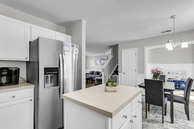 125 Towering Pine Dr, Ladson, SC 29456 - kitchen featuring stainless steel fridge, white cabinetry, and light countertops