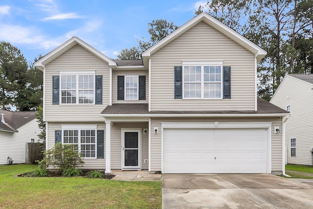 125 Towering Pine Dr, Ladson, SC 29456 - view of front of house featuring an attached garage, concrete driveway, a front lawn, and a shingled roof