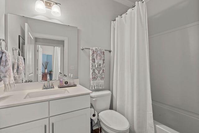 full bathroom featuring toilet, shower / bathtub combination with curtain, and vanity