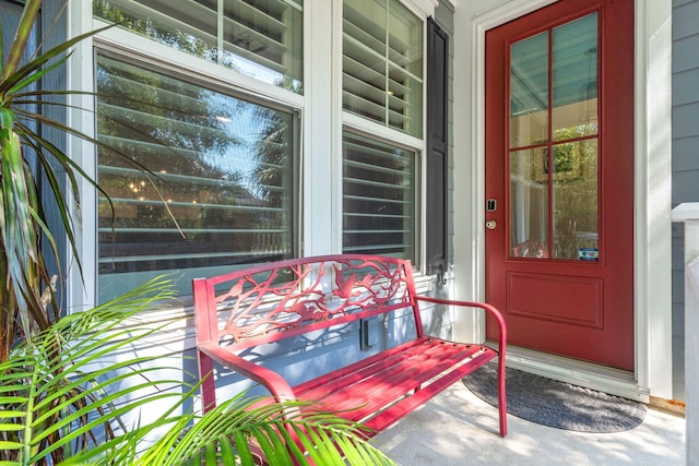 view of exterior entry featuring a porch