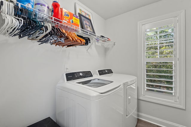 laundry room featuring laundry area, independent washer and dryer, and baseboards