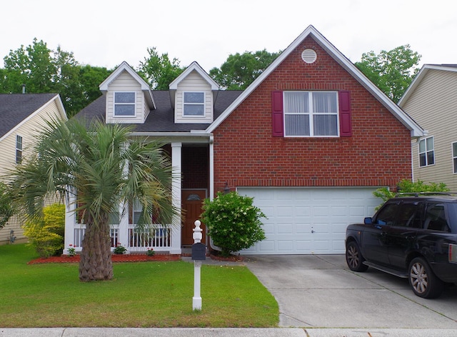 view of front of property featuring brick siding, driveway, a front yard, and a garage