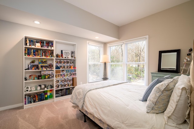 carpeted bedroom featuring recessed lighting and baseboards