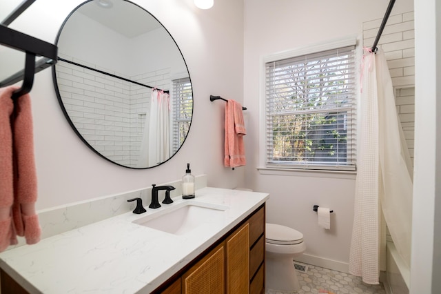 bathroom with toilet, baseboards, visible vents, and vanity