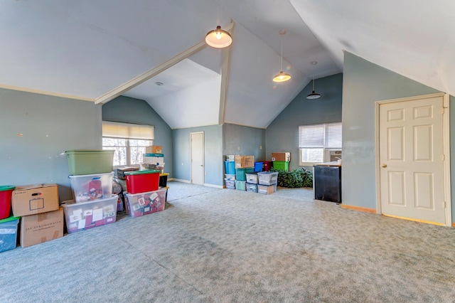 playroom with a healthy amount of sunlight, carpet, and vaulted ceiling