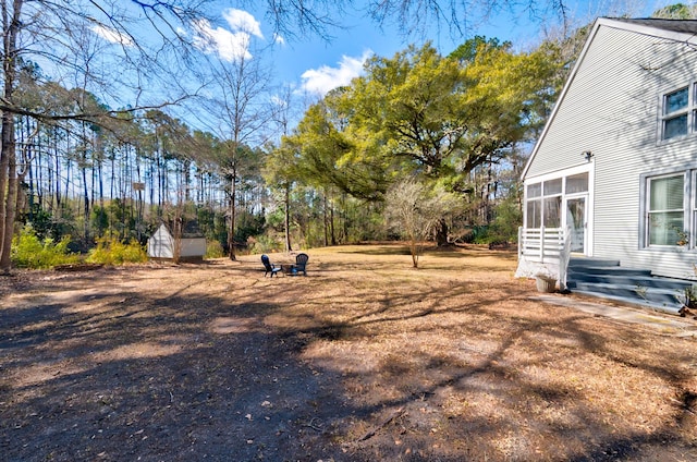 view of yard featuring a sunroom