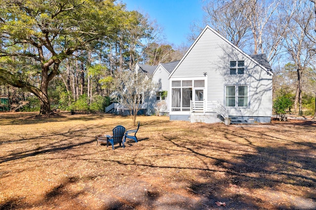 back of property featuring a sunroom