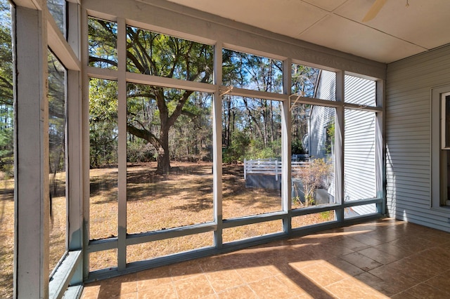 unfurnished sunroom featuring a healthy amount of sunlight