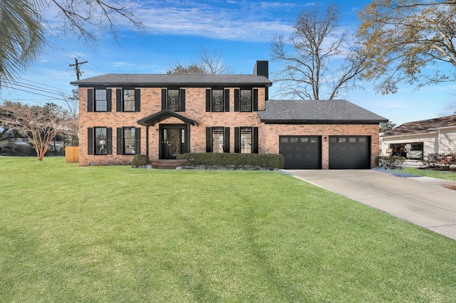 colonial house with a garage and a front yard