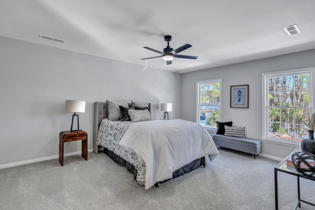 bedroom with light colored carpet and ceiling fan