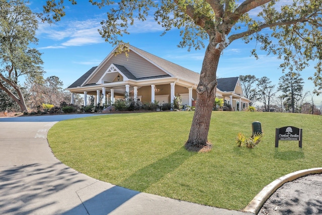 view of front of property with a front lawn and covered porch