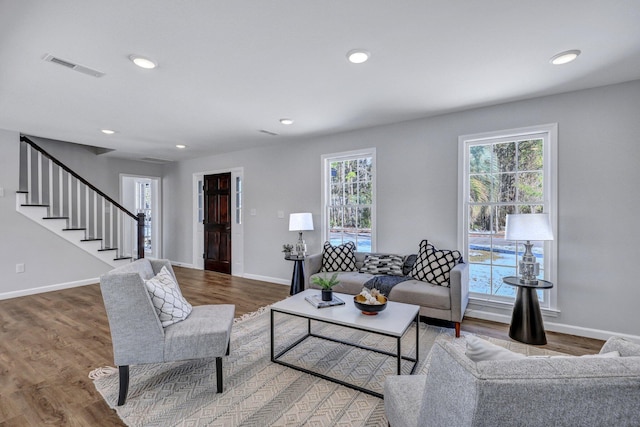 living room with a wealth of natural light and hardwood / wood-style floors