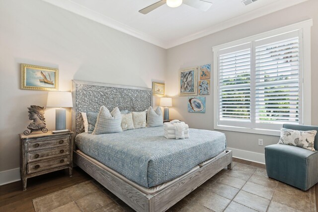 bedroom with ceiling fan, ornamental molding, and wood-type flooring