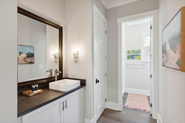 bathroom featuring hardwood / wood-style floors and vanity