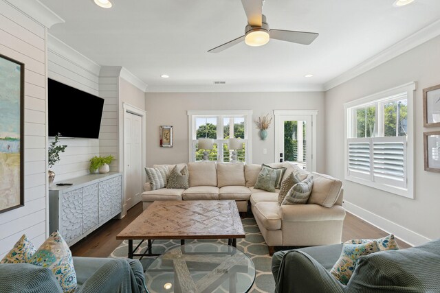 living room featuring crown molding, ceiling fan, and hardwood / wood-style floors