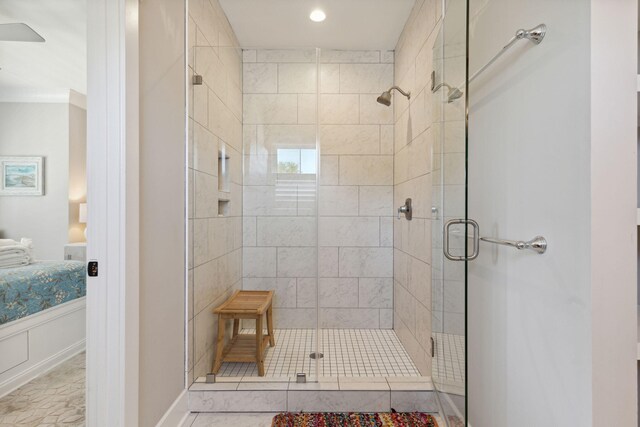 bathroom with a shower with door