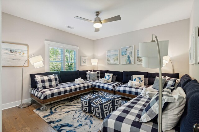 living room with ceiling fan and hardwood / wood-style flooring