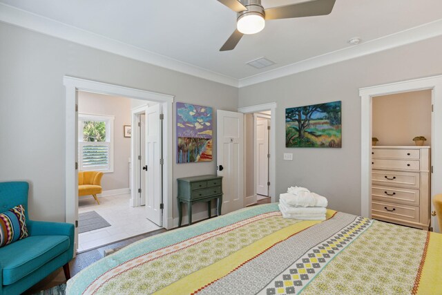 bedroom with crown molding, ceiling fan, and tile patterned floors