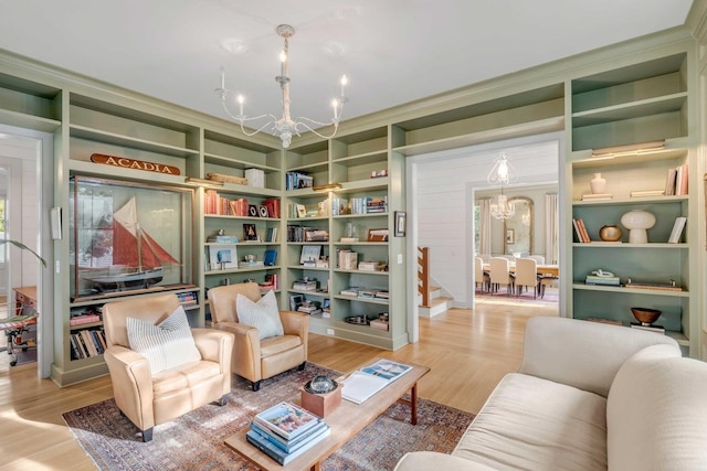 222 Haddrell St, Mount Pleasant, SC 29464 - living room with a chandelier, light wood-style floors, and built in shelves