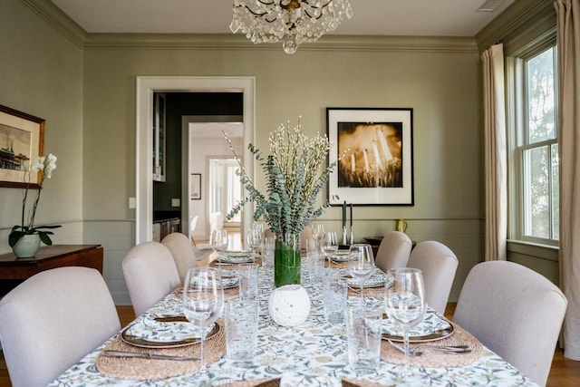 222 Haddrell St, Mount Pleasant, SC 29464 - dining room featuring healthy amount of natural light, a chandelier, and ornamental molding