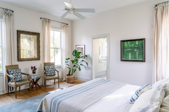 222 Haddrell St, Mount Pleasant, SC 29464 - bedroom with wood finished floors, crown molding, and connected bathroom