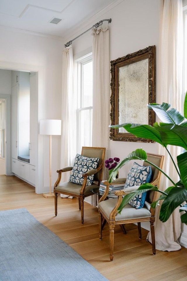 222 Haddrell St, Mount Pleasant, SC 29464 - sitting room with light wood-style flooring and ornamental molding