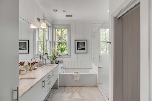 222 Haddrell St, Mount Pleasant, SC 29464 - bathroom featuring a bath, double vanity, a stall shower, and tile patterned flooring