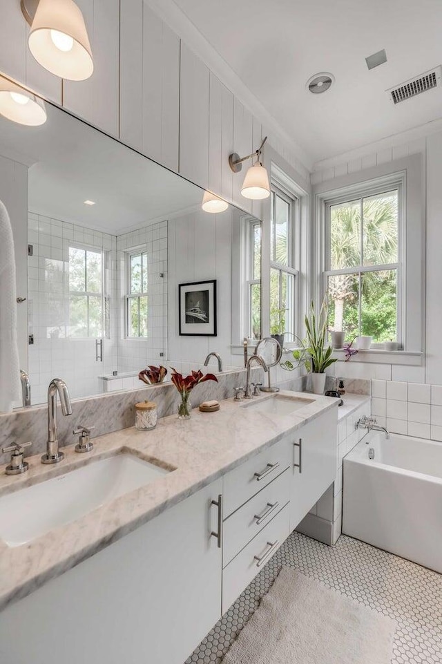 222 Haddrell St, Mount Pleasant, SC 29464 - full bathroom featuring double vanity, a garden tub, and tile patterned floors