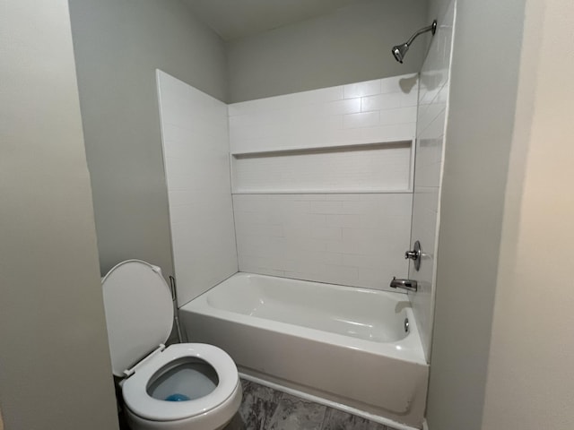 bathroom with toilet and shower / washtub combination