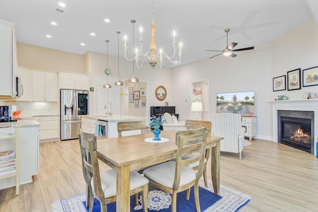 5078 Song Sparrow Way, Summerville, SC 29483 - dining room featuring ceiling fan, light wood-type flooring, a glass covered fireplace, recessed lighting, and a chandelier