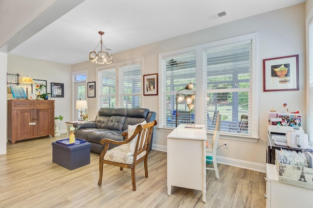 5078 Song Sparrow Way, Summerville, SC 29483 - living room featuring light wood-style flooring, a chandelier, and baseboards