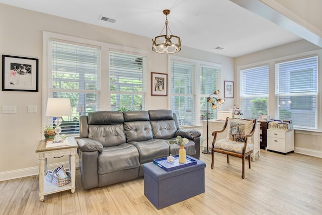 5078 Song Sparrow Way, Summerville, SC 29483 - living room featuring light wood-style floors, plenty of natural light, a chandelier, and baseboards
