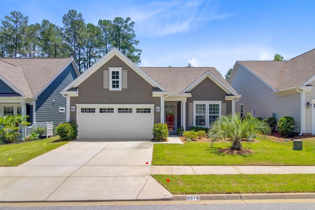 5078 Song Sparrow Way, Summerville, SC 29483 - view of front facade featuring concrete driveway, a front yard, and an attached garage