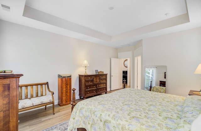 5078 Song Sparrow Way, Summerville, SC 29483 - bedroom with light wood-style floors and a raised ceiling
