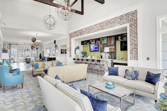 5078 Song Sparrow Way, Summerville, SC 29483 - living area featuring a chandelier, ornamental molding, a wainscoted wall, and a decorative wall