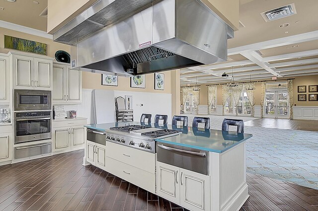5078 Song Sparrow Way, Summerville, SC 29483 - kitchen with wall chimney range hood, a warming drawer, appliances with stainless steel finishes, coffered ceiling, and recessed lighting