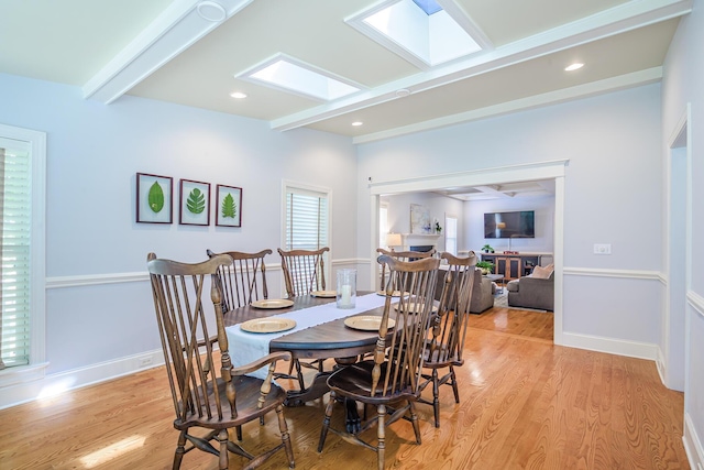 dining space featuring baseboards, beamed ceiling, light wood-style flooring, and recessed lighting
