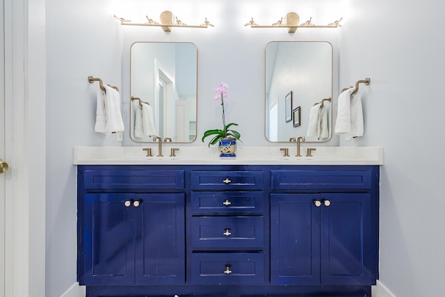 bathroom featuring double vanity and a sink