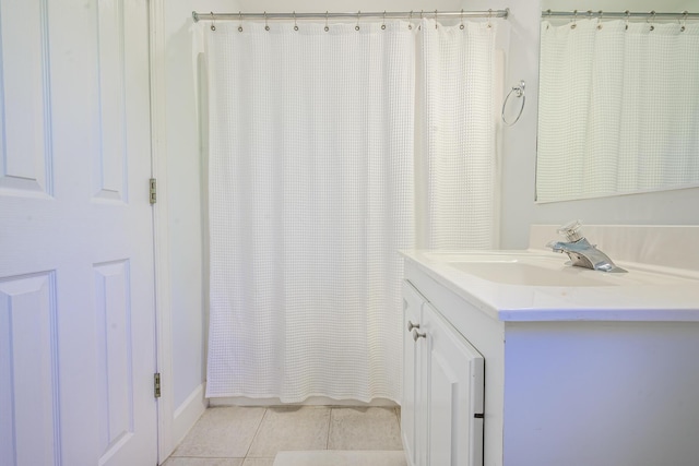 bathroom with tile patterned flooring, vanity, and a shower with shower curtain