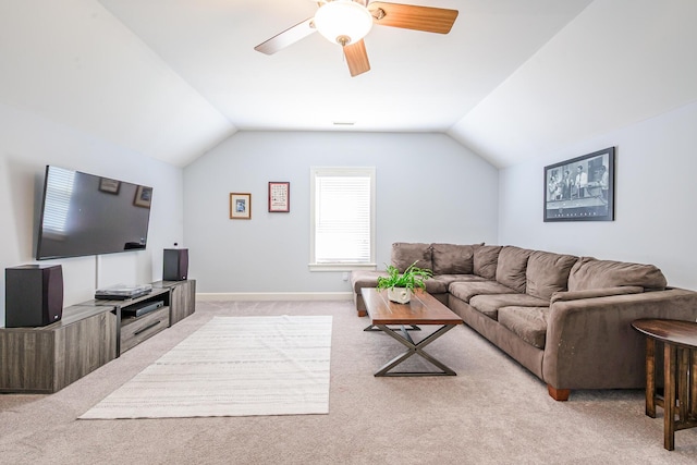living room featuring a ceiling fan, light carpet, baseboards, and lofted ceiling