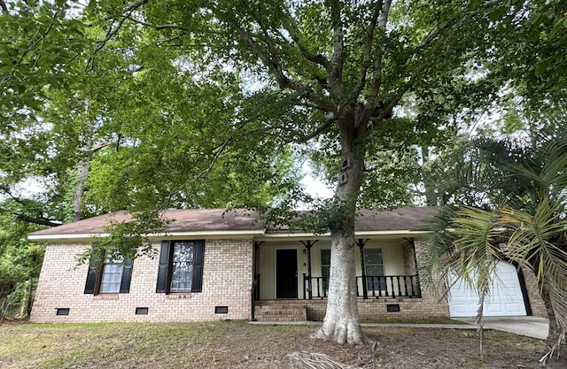 106 Pelican St, Ladson, SC 29456 - ranch-style house with covered porch, concrete driveway, brick siding, and crawl space