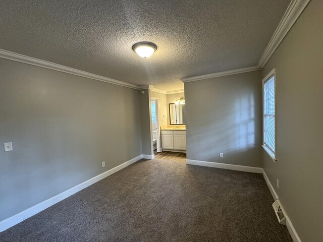 106 Pelican St, Ladson, SC 29456 - empty room featuring crown molding, a textured ceiling, visible vents, baseboards, and dark colored carpet