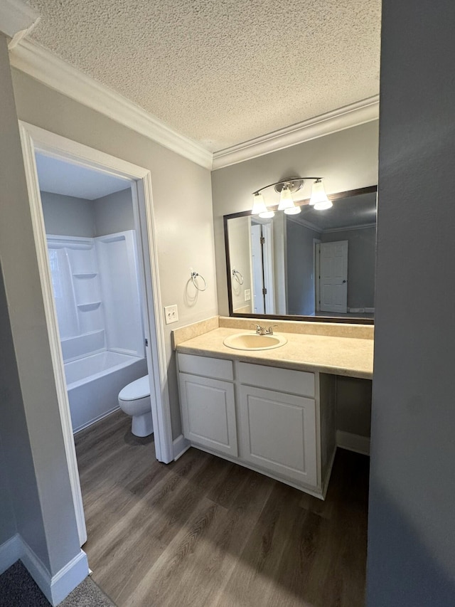106 Pelican St, Ladson, SC 29456 - bathroom featuring toilet, wood finished floors, vanity, ornamental molding, and a textured ceiling