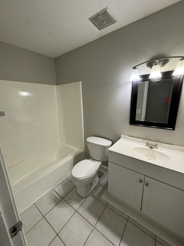 106 Pelican St, Ladson, SC 29456 - bathroom featuring toilet, vanity, a textured ceiling, visible vents, and tile patterned floors