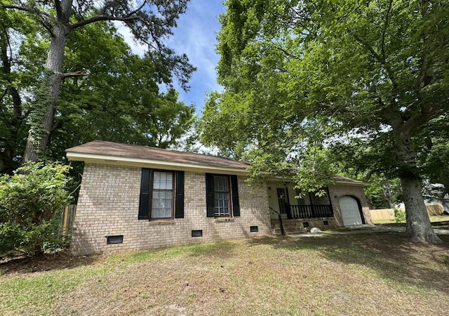 106 Pelican St, Ladson, SC 29456 - single story home with a front yard, a garage, brick siding, and crawl space