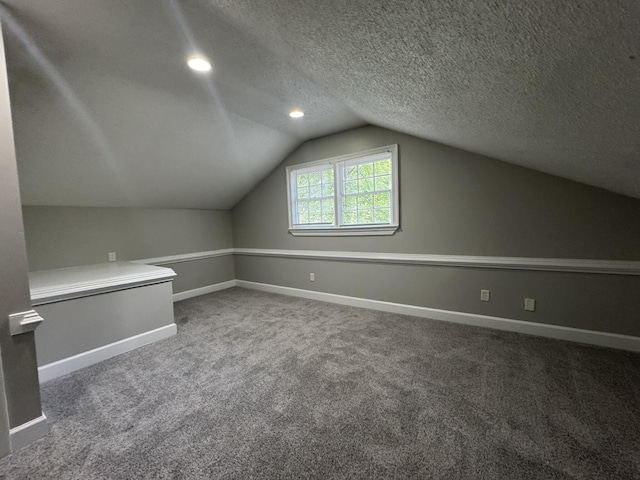 106 Pelican St, Ladson, SC 29456 - additional living space featuring vaulted ceiling, a textured ceiling, carpet, and baseboards