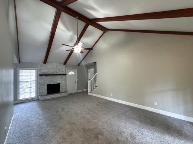 106 Pelican St, Ladson, SC 29456 - unfurnished living room featuring beam ceiling, carpet, a fireplace, ceiling fan, and baseboards