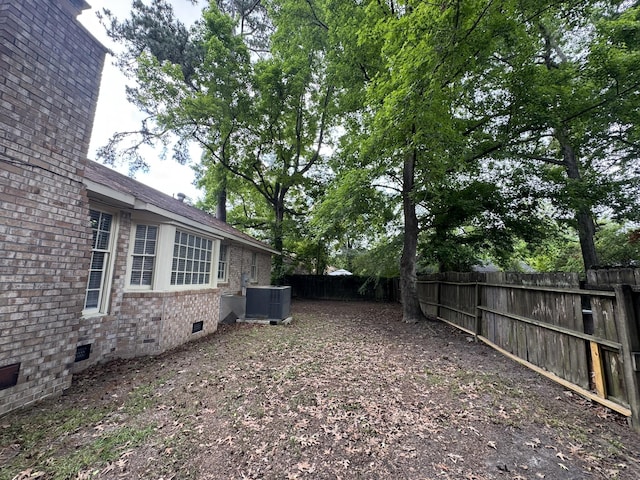 106 Pelican St, Ladson, SC 29456 - view of yard with central AC unit and a fenced backyard