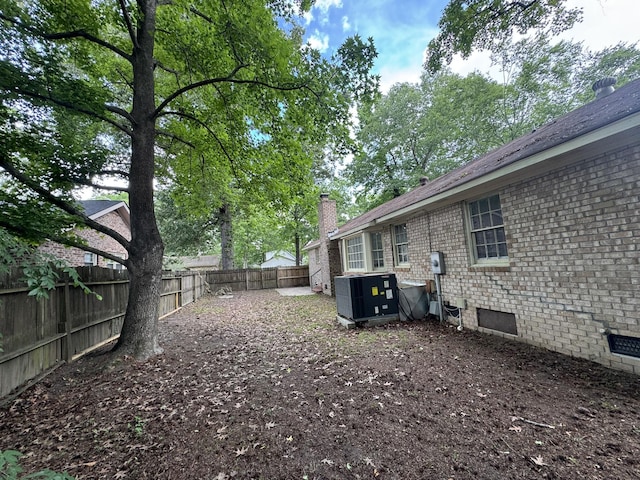 106 Pelican St, Ladson, SC 29456 - view of yard featuring central AC unit and a fenced backyard