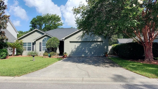 single story home with a garage, driveway, and a front yard